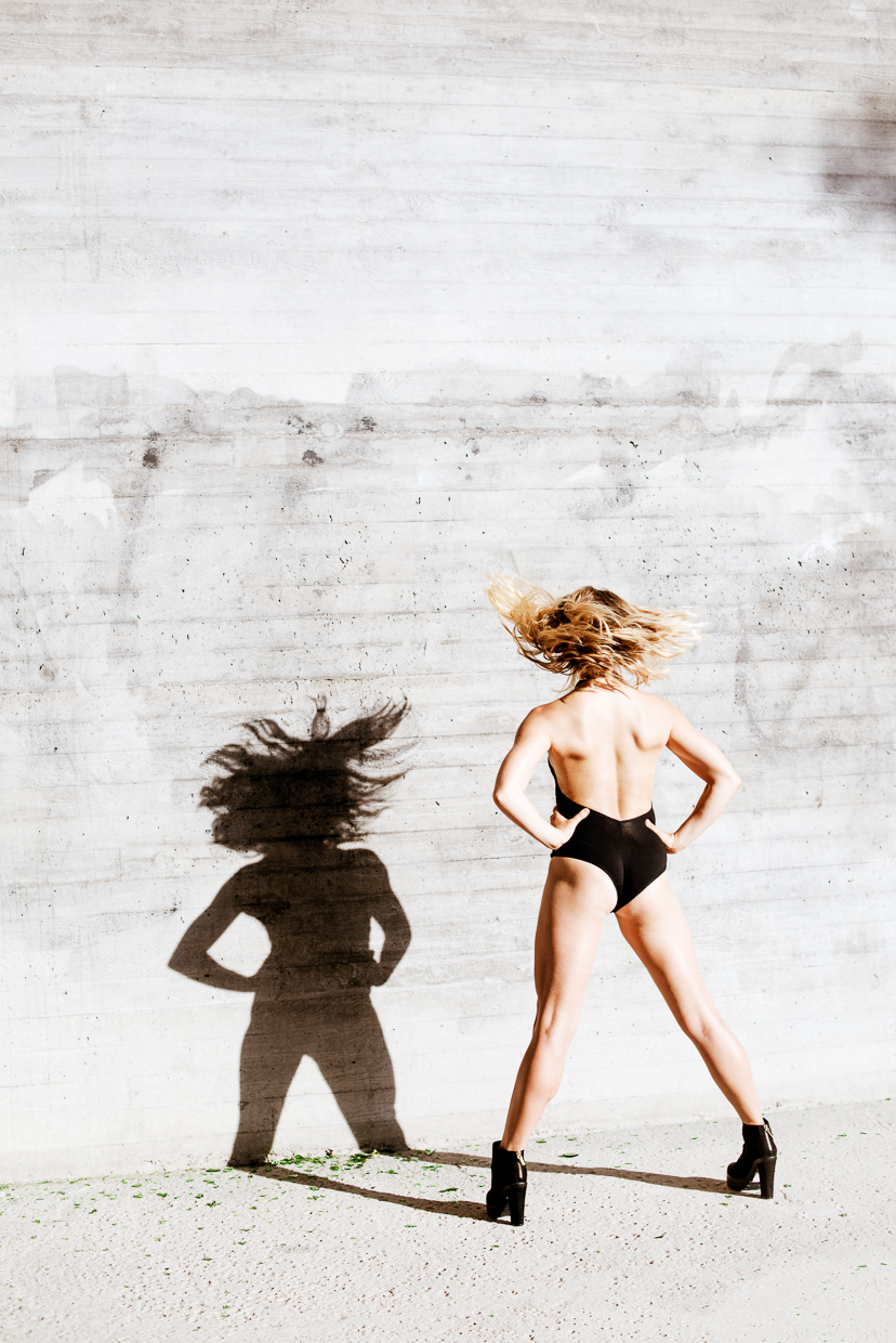 Tilda Kristiansson whipping her hair. Her shadow on the wall.